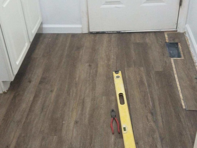 Photo of a floor in the process of being repaired